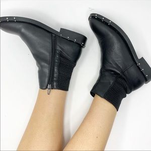 EUC black leather bootie with studs.